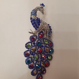 Blue and multi colored crystal peacock brooch